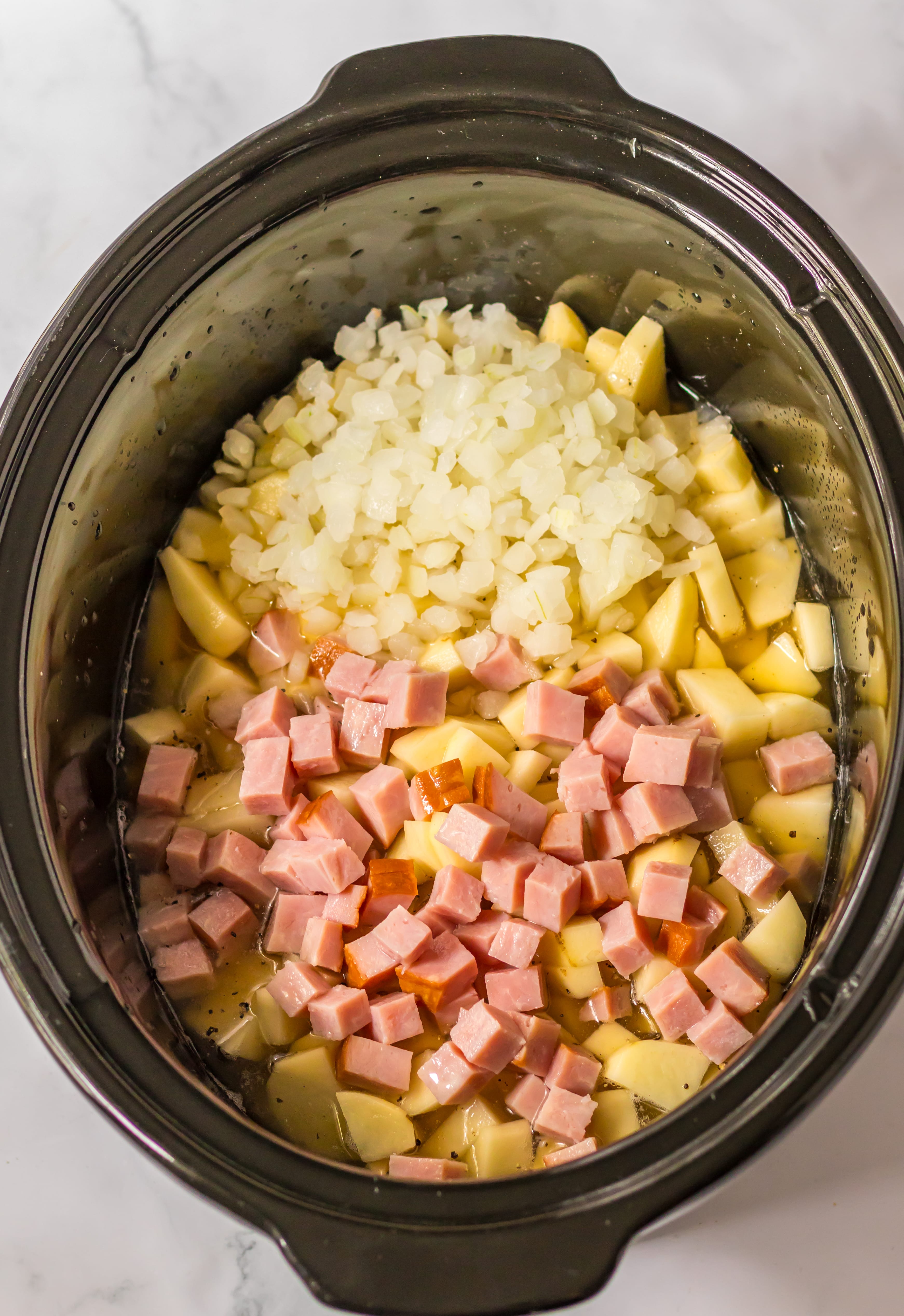 https://lifewiththecrustcutoff.com/wp-content/uploads/2023/08/Slow-Cooker-Cheesy-Potato-Ham-Soup-Process-9.jpg