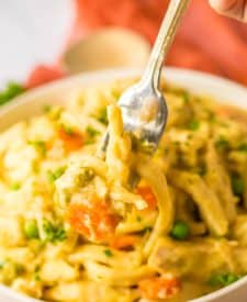 Slow Cooker Chicken and Noodles on fork
