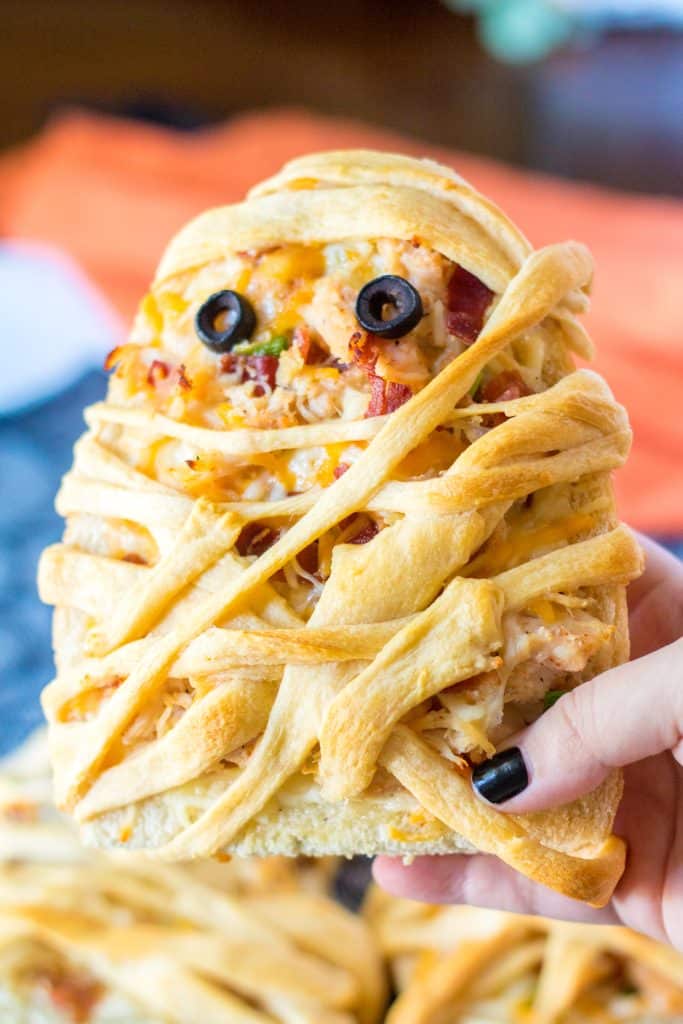 Chicken Bacon Ranch Mummy Pizza in hand