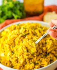 Slow Cooker Cheesy Chicken Rice in spoon