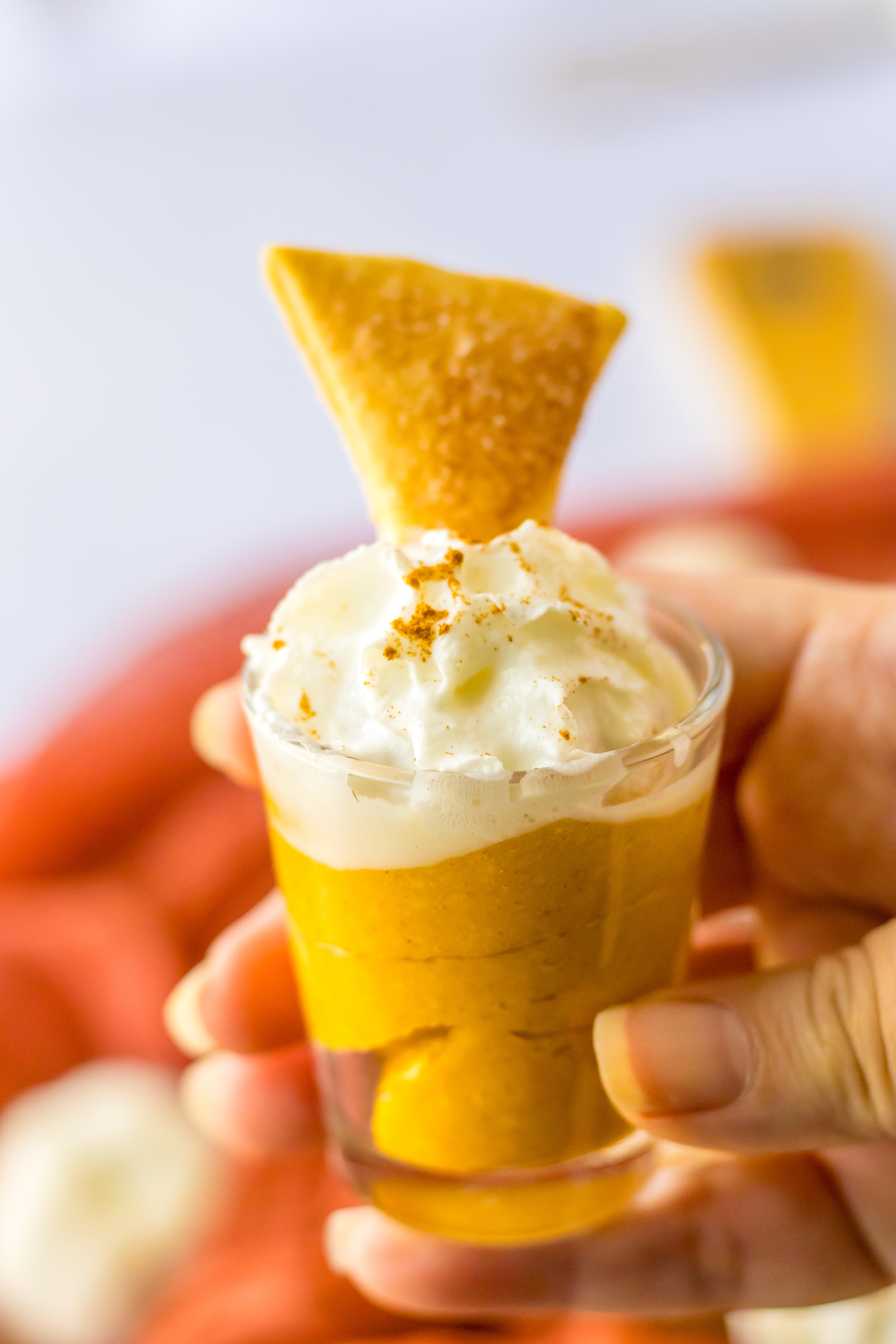 Pumpkin Pie Pudding Shots in hand