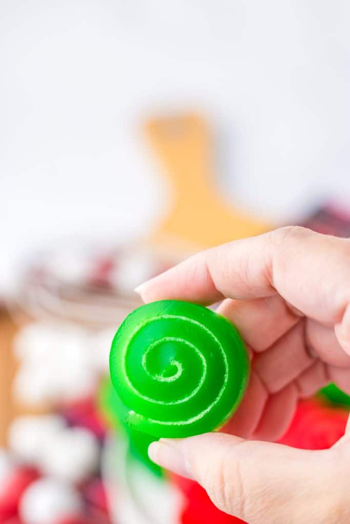 Christmas Jello Roll Ups in hand