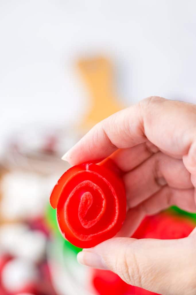 Christmas Jello Roll Ups in hand
