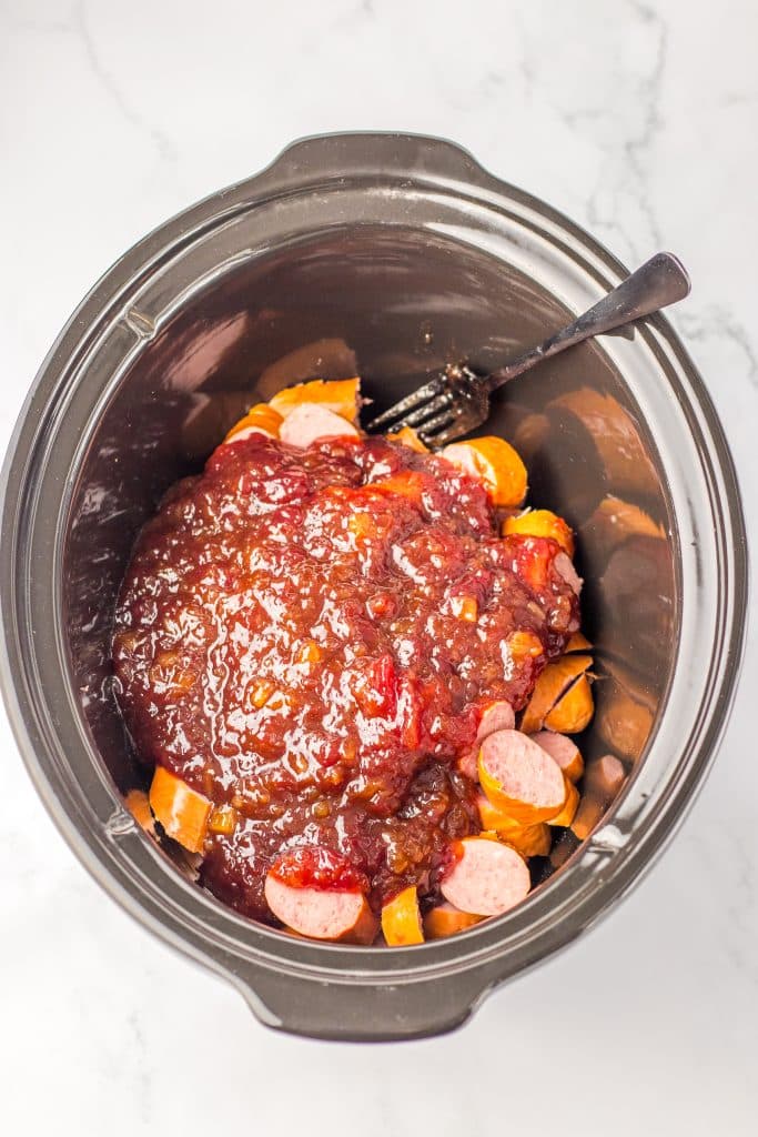 Slow Cooker Cranberry Pineapple Kielbasa Bites ingredients in slow cooker