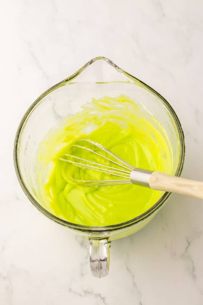 Grinch Cinnamon Rolls frosting