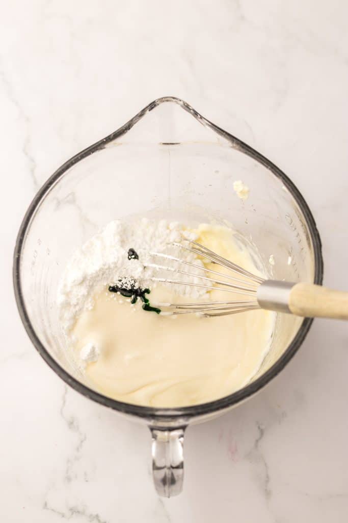 Grinch Cinnamon Rolls frosting