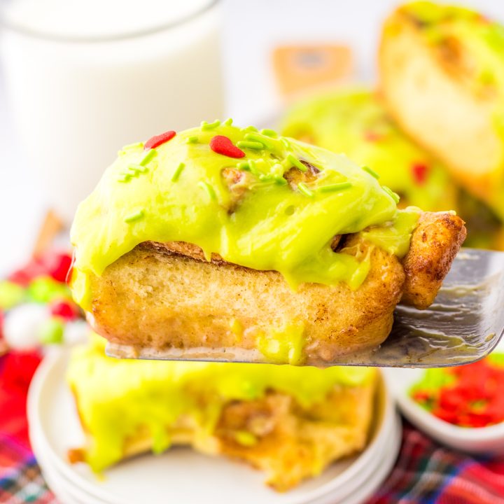 Grinch Cinnamon Rolls on spatula