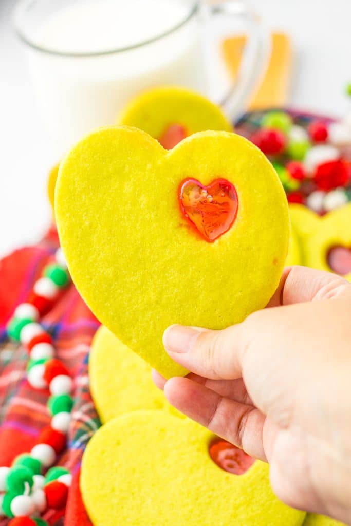 Grinch Stained Glass Cookies in hand