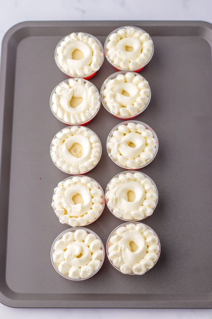 Santa Hat Jello Shots whipped topping on cups