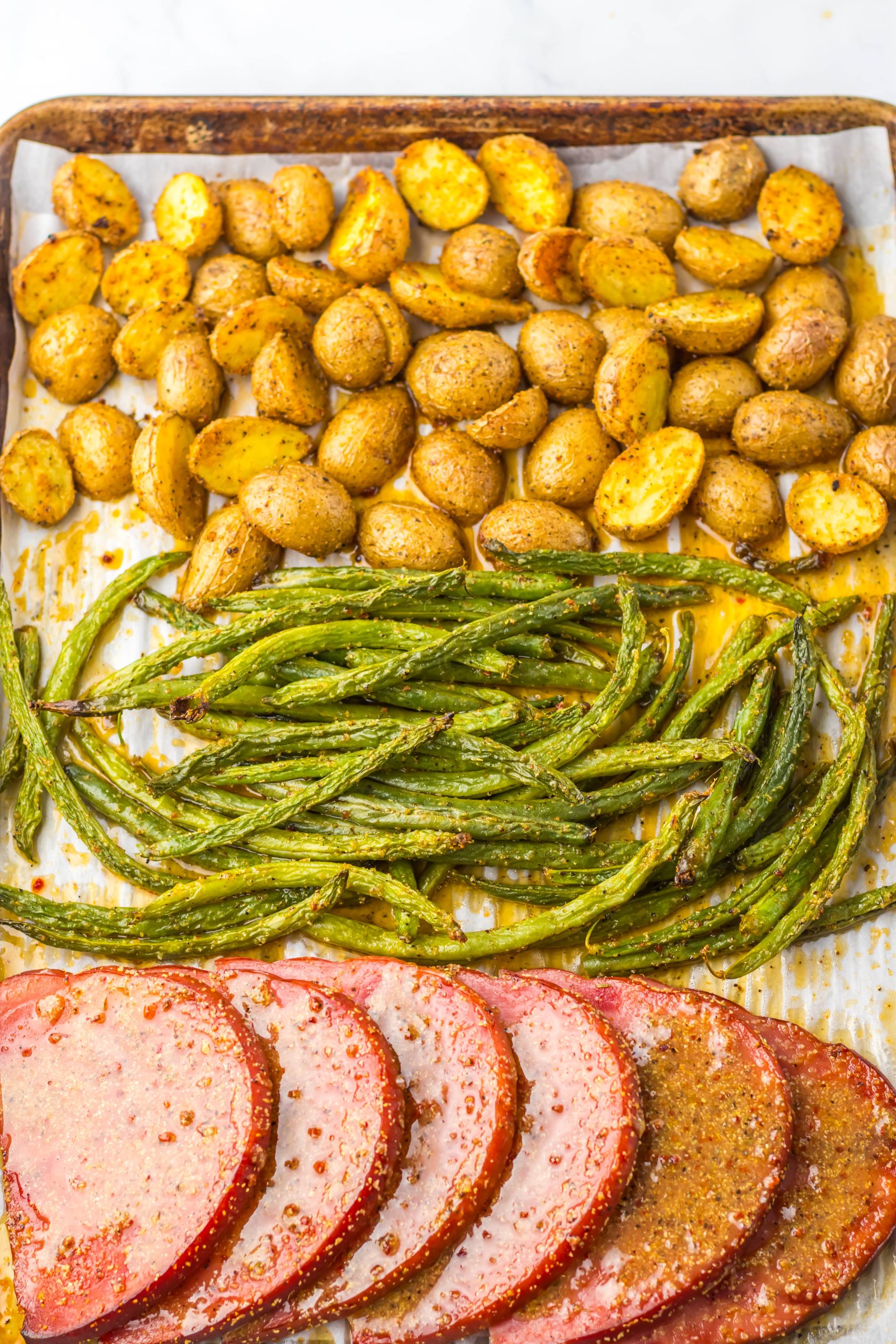 Sheet Pan Ham Steak Dinner on pan
