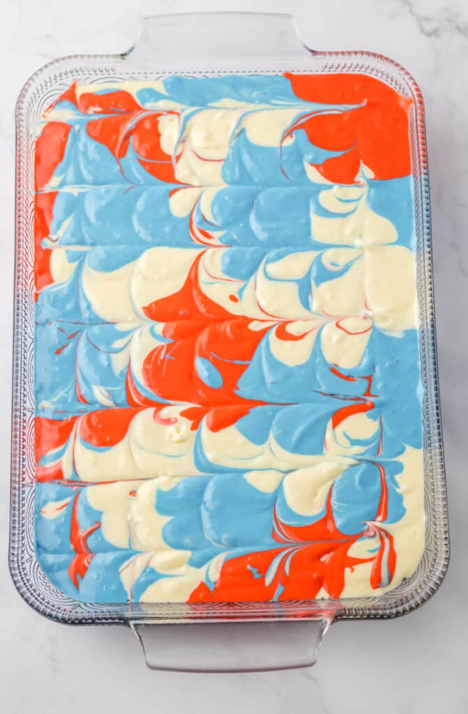 Red White Blue Cheesecake Bars batter swirled