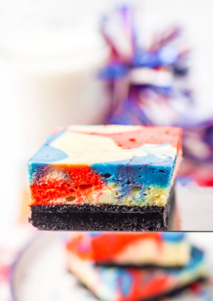 Red White Blue Cheesecake Bars on spatula