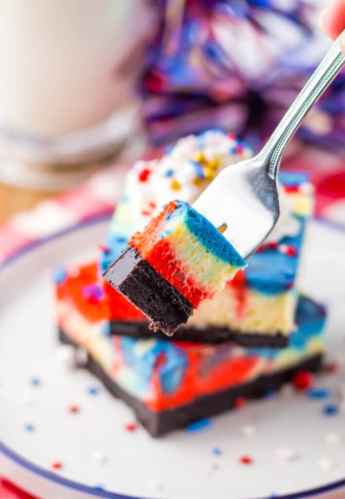 Red White Blue Cheesecake Bars on fork