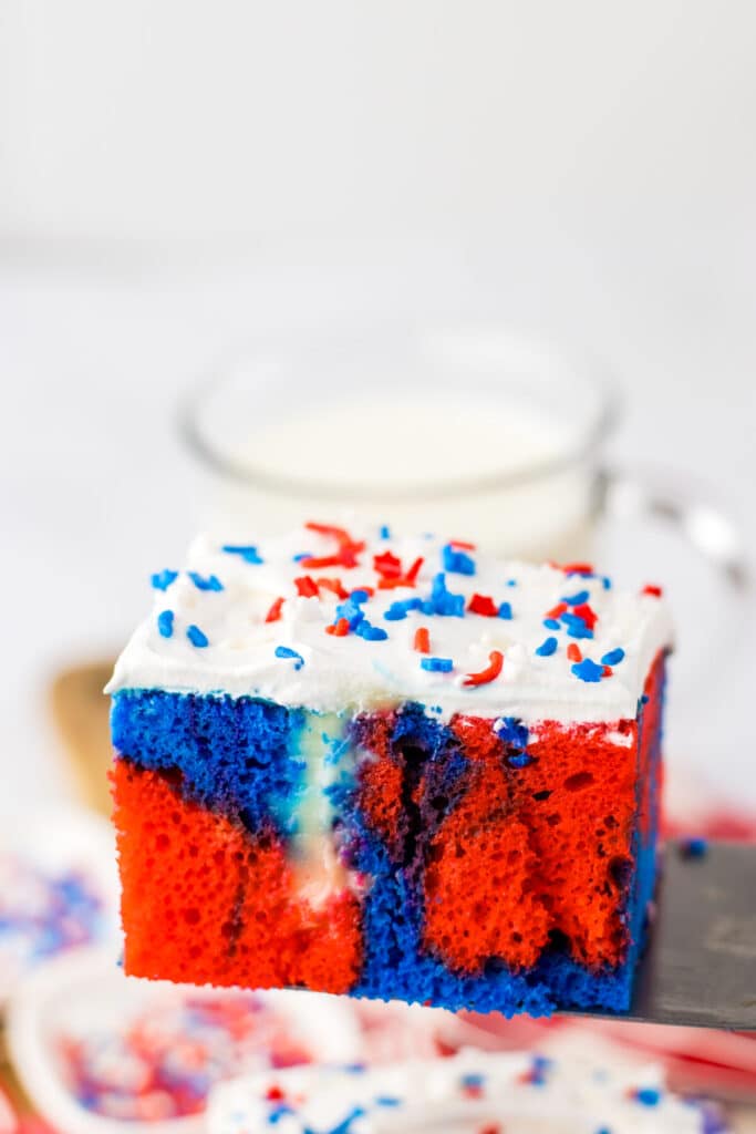 Red White Blue Poke Cake on spatula