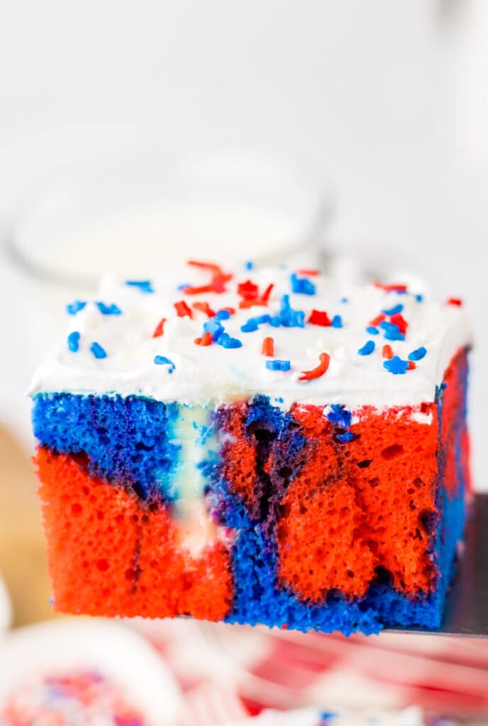 Red White Blue Poke Cake on spatula