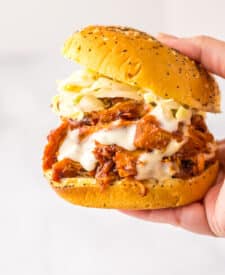 Slow Cooker BBQ Ranch Chicken Sandwiches in hand