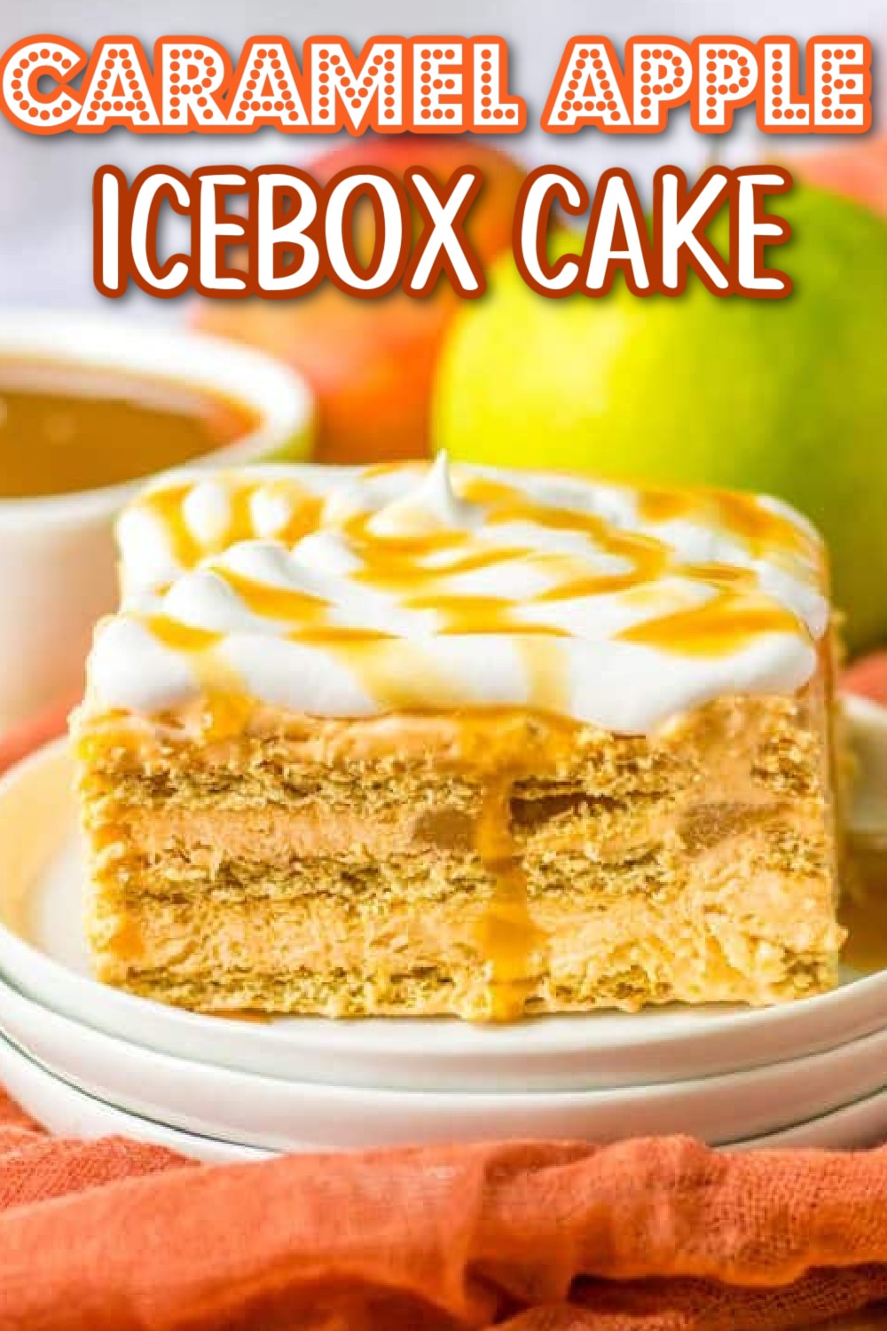 Close-up of a layered caramel apple icebox cake topped with whipped cream and caramel drizzle on a white plate