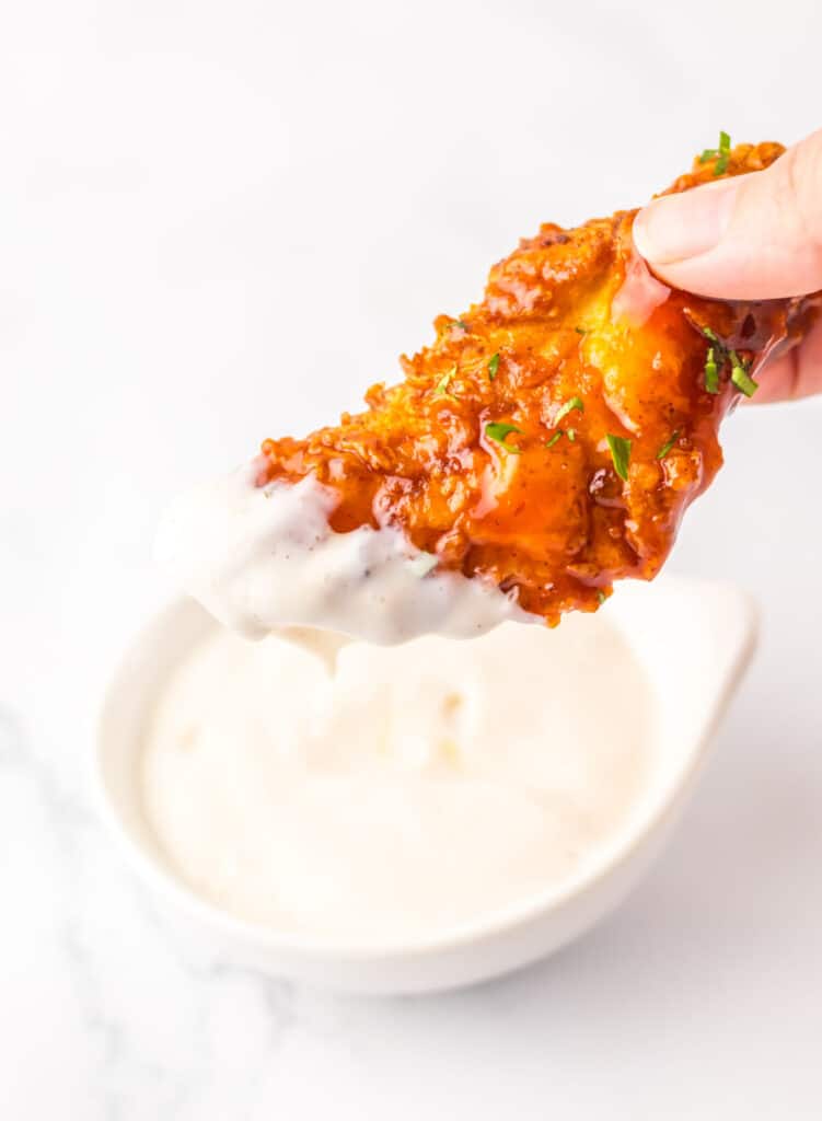 Copycat Chilis Honey Chipotle Crispers dipped in ranch