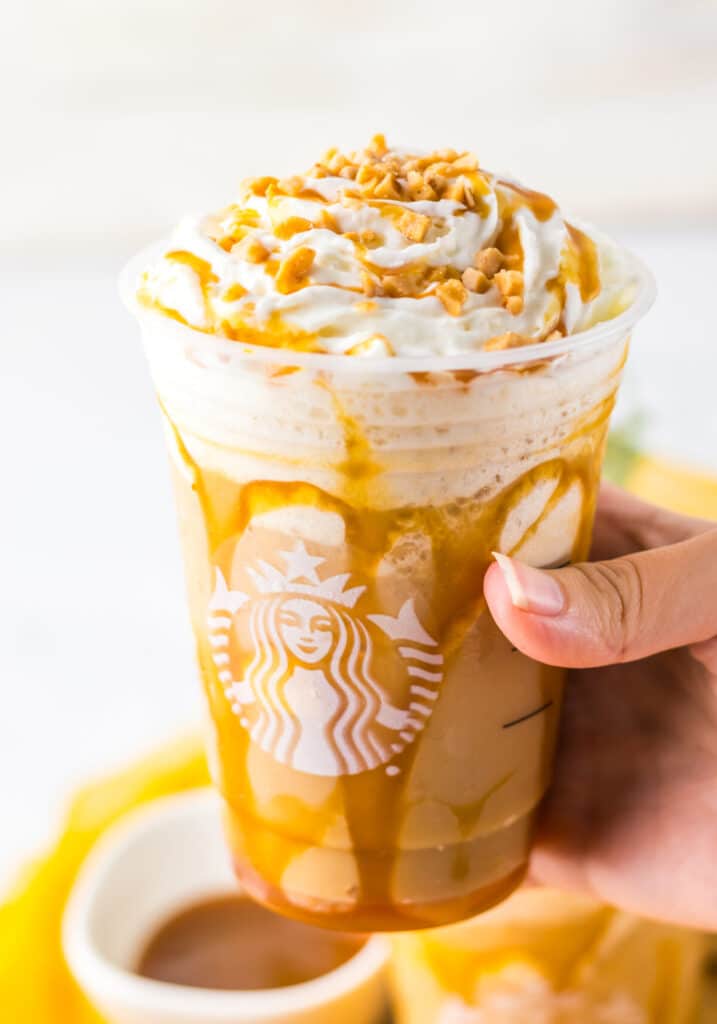 Copycat Starbucks Caramel Ribbon Crunch Frappuccino in hand