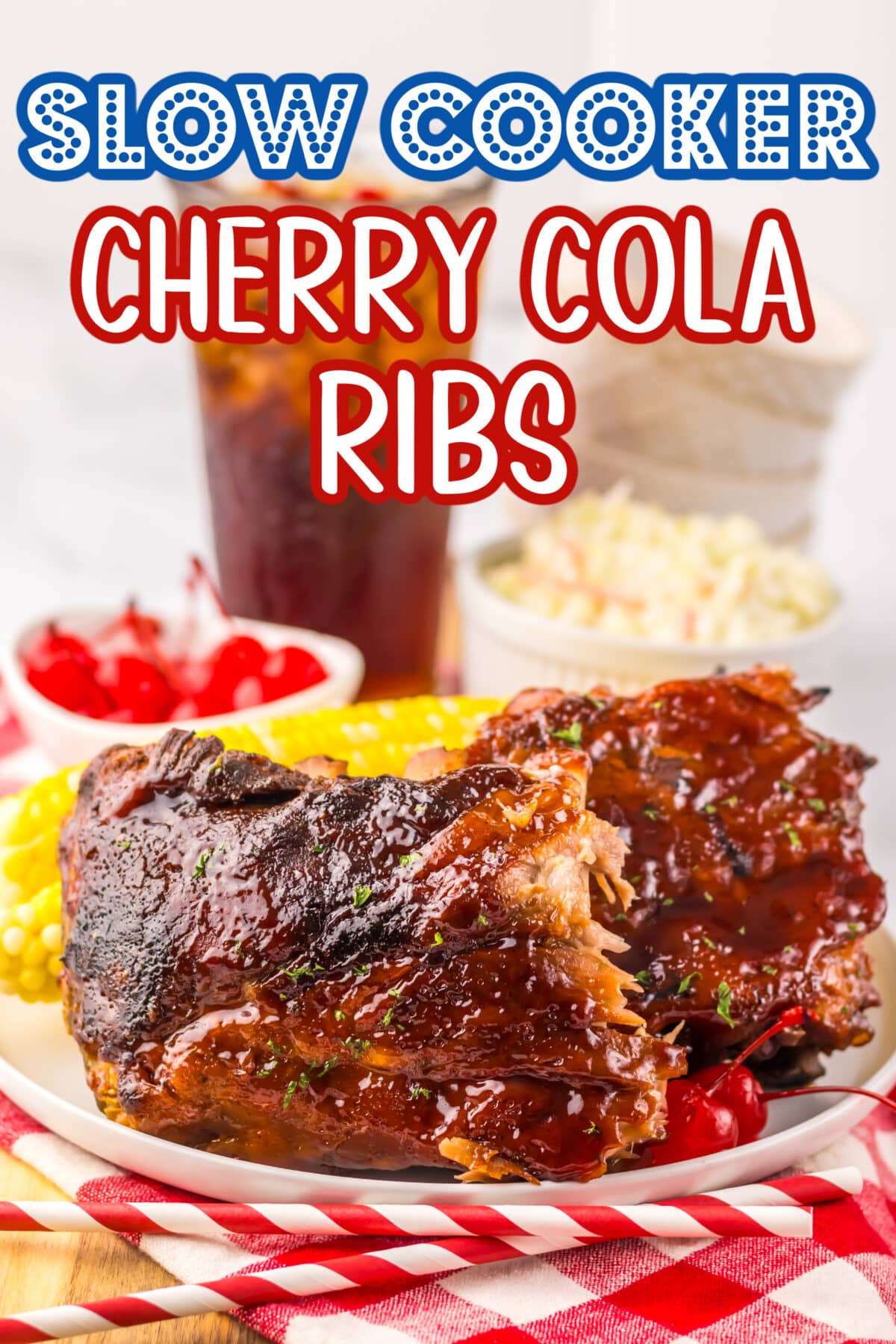 Tender slow cooker ribs glazed with cherry cola BBQ sauce and served with fresh herbs on a white platter