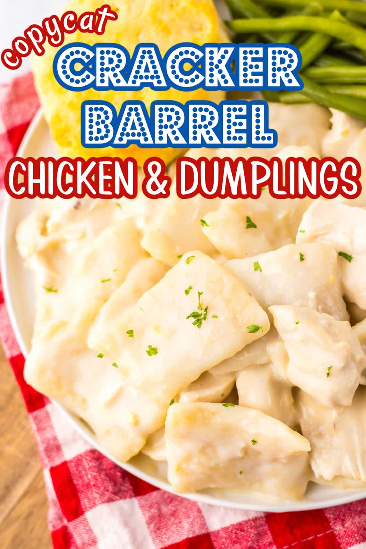 Bowl of creamy chicken and dumplings garnished with parsley, served with cornbread and green beans.