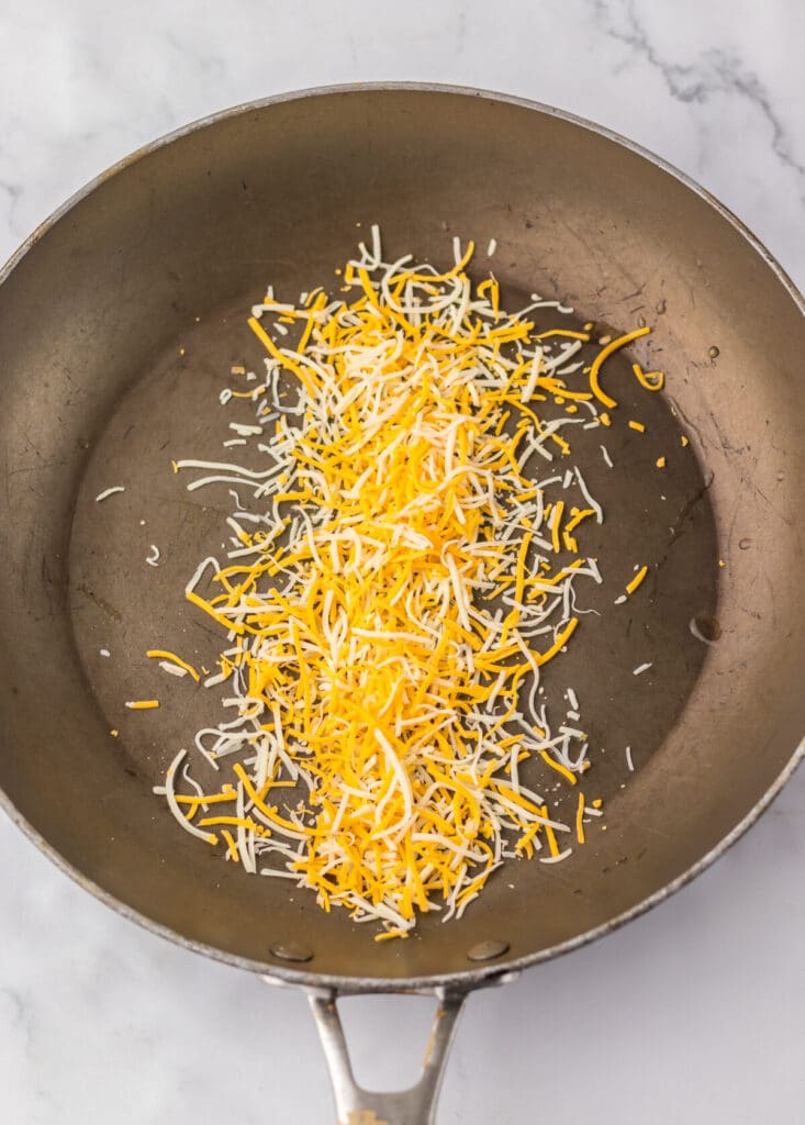 Copycat Taco Bell Grilled Cheese Burritos cheese in pan