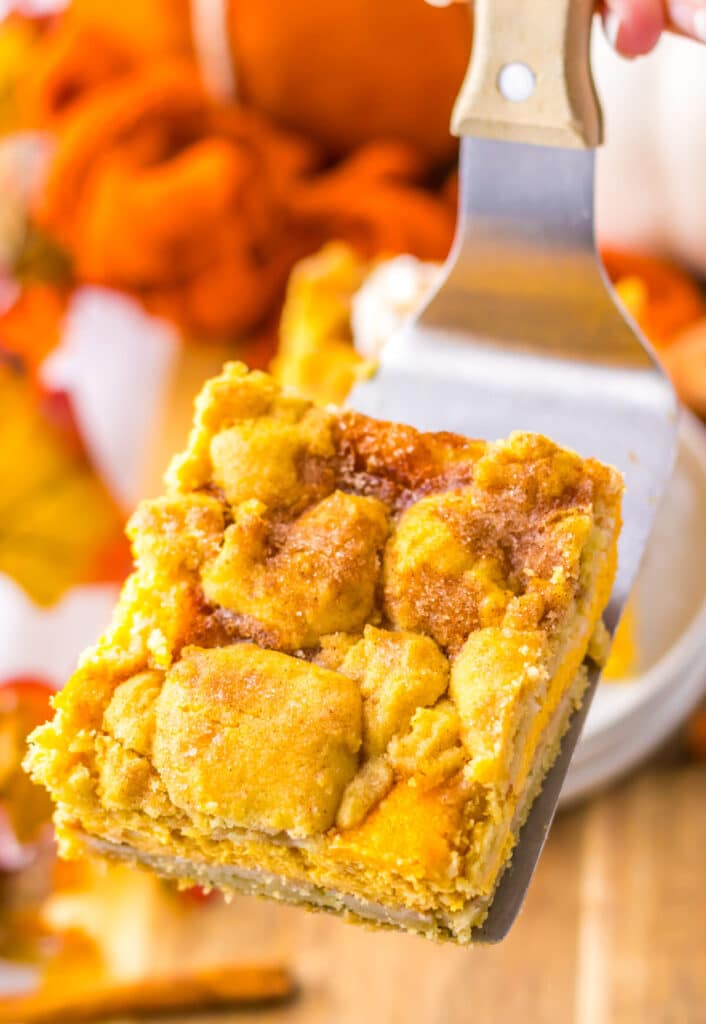 Pumpkin Cheesecake Snickerdoodle Bars on spatula