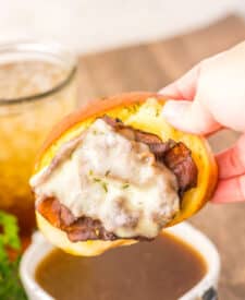 Garlic Bread French Dips dipping in au jus