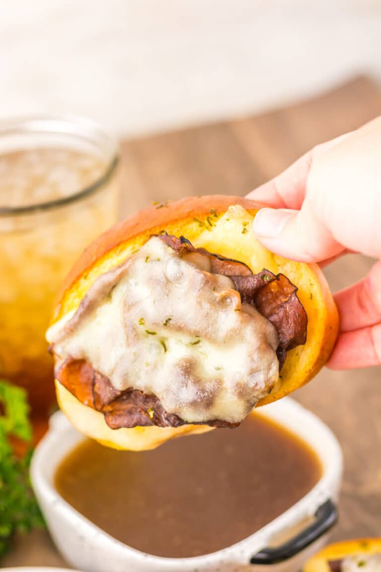 Garlic Bread French Dips dipping in au jus