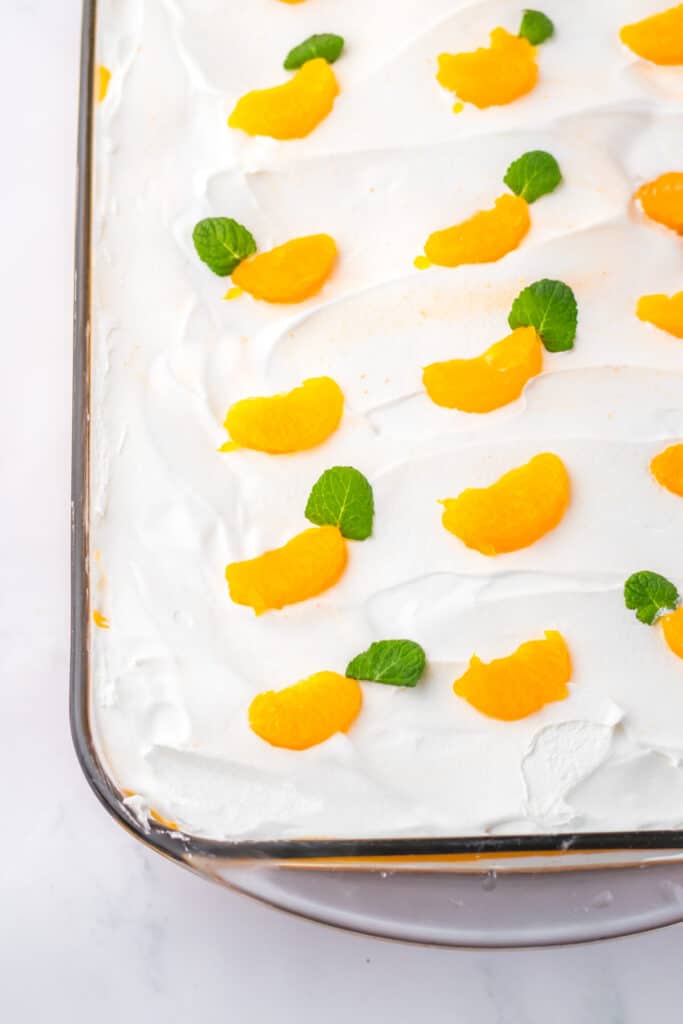 Orange Creamsicle Poke Cake in pan