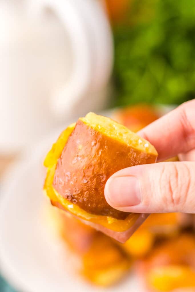 Hot Honey Ham Pretzel Sliders in hand