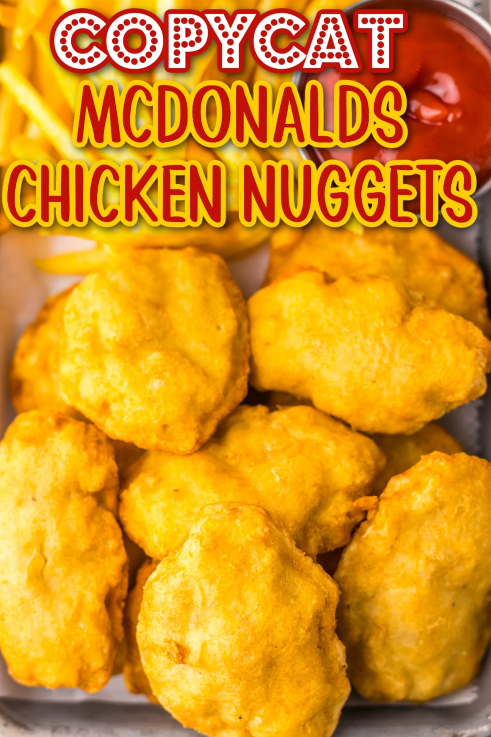 Homemade McDonald’s-style chicken nuggets served with crispy fries and ketchup, perfect for easy weeknight dinners