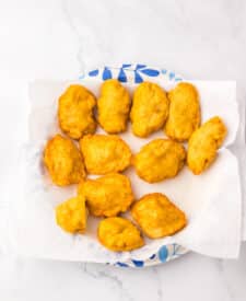 “Freshly fried copycat McDonald’s chicken nuggets draining on paper towels”