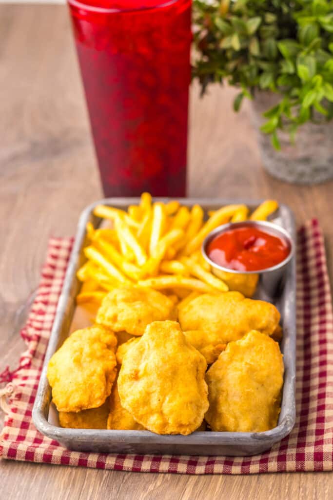 “Crispy golden copycat McDonald’s chicken nuggets served with fries and ketchup”
