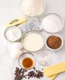 "Ingredients for Black Tie Mousse Cake including cocoa, cream cheese, chocolate chips, and cream."