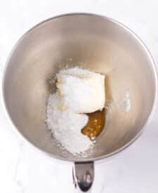 Chocolate cake with mousse layers being assembled for homemade Black Tie Mousse Cake."