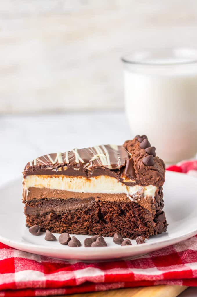 "Slice of homemade Olive Garden Black Tie Mousse Cake showing chocolate cake, mousse layers, and ganache."