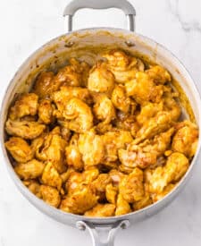 “Golden fried chicken pieces coated in homemade orange sauce”