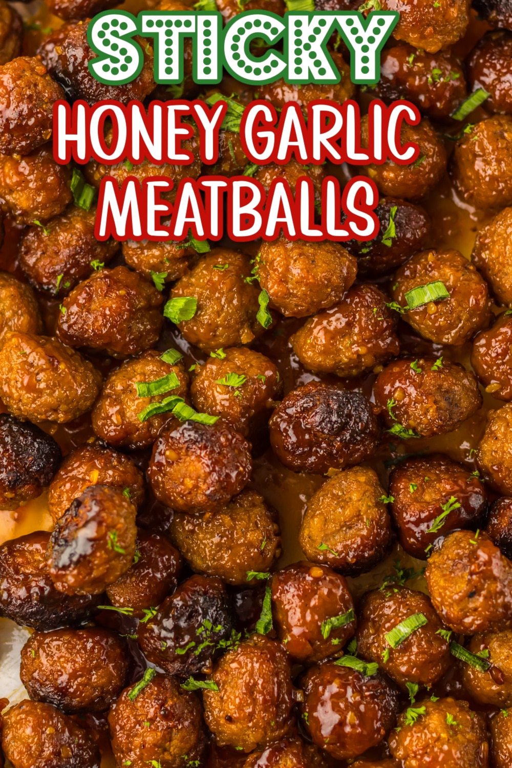 Sticky honey garlic meatballs coated in sauce and served with rice and green onions