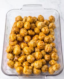 “Meatballs being coated in homemade honey garlic glaze”