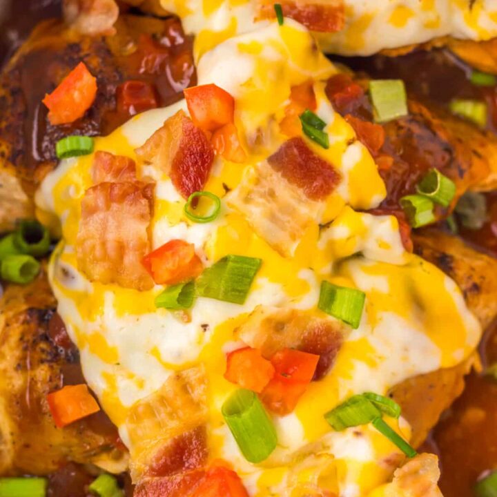Overhead view of cheesy Monterey Chicken topped with bacon and scallions