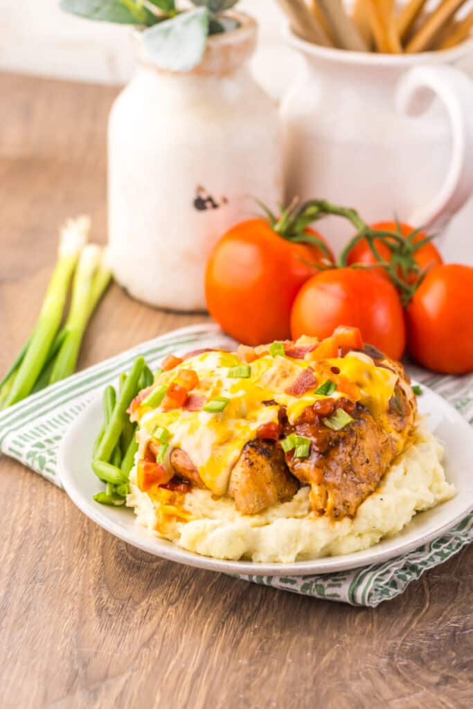 Slow Cooker Monterey Chicken topped with bacon, BBQ sauce, and melted cheese