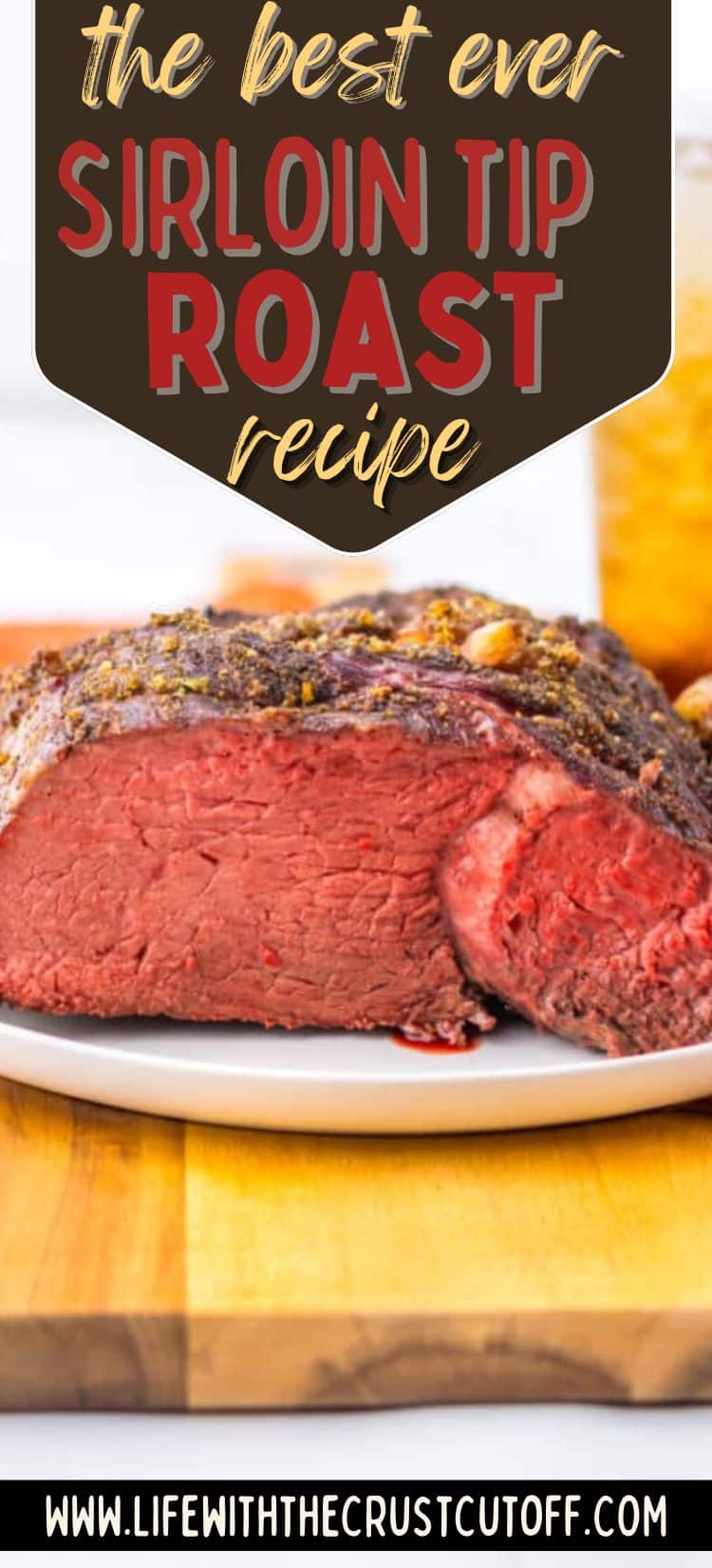 Juicy medium-rare sirloin tip roast sliced on a white plate.