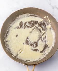 Close-up of creamy sauce in a pan.