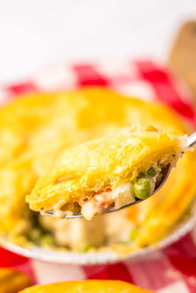 Creamy chicken pot pie on spoon