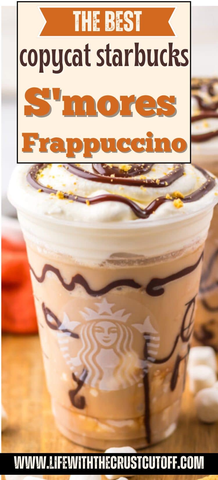 A decadent s’mores frappuccino topped with whipped cream, chocolate sauce, and graham cracker crumbs served in a glass.