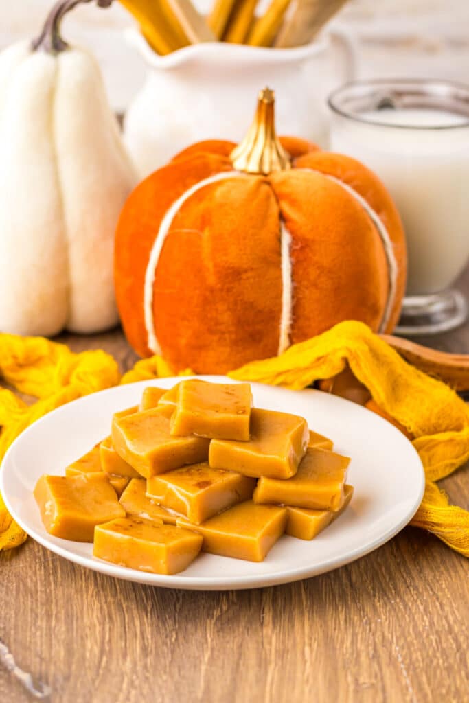 Festive pumpkin spice caramels on a plate with bright fall colors