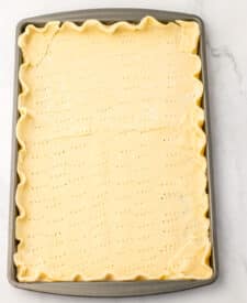 Unbaked pie crust pressed into sheet pan for French silk pie recipe