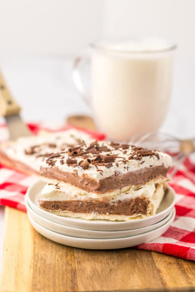 Creamy layered French silk pie slice with chocolate filling and flaky crust
