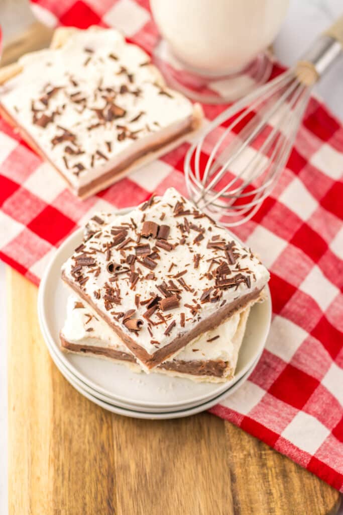 Overhead shot of sheet pan French silk pie slice with red checkered napkin